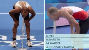 ht1-olympic-star-vomits-10-times-on-live-tv-after-swimming-in-polluted-paris-river-j2vko6w2